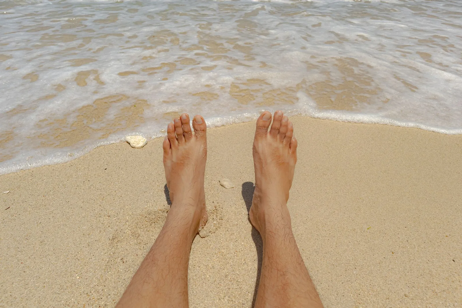 Enjoying the soft sand and gentle waves. Perfect summer getaway.